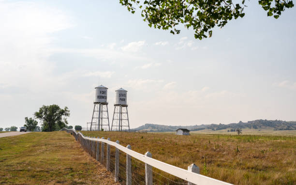A low angle view of a small town water tower.