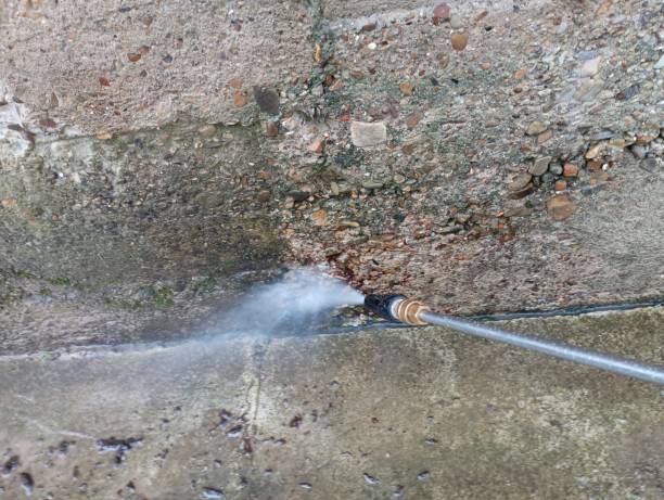 istock The process of washing the old concrete foundation for its cladding and treatment with natural materials. Surface washing with a high pressure washer 2164442604