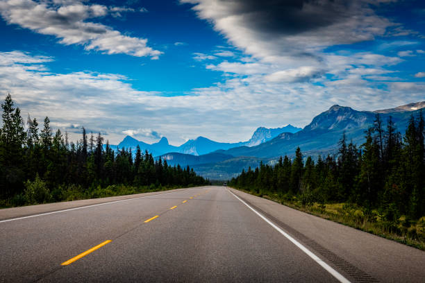 istock driving with a car on a mountain road in Alberta in Canada 2164455270
