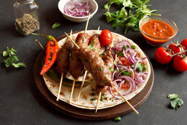 istock Grilled lula kebab with fresh vegetables on flat bread 2164457176