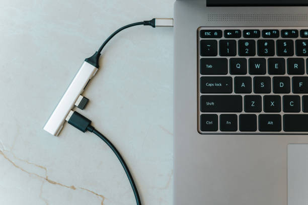 istock Close up of type c usb hub with multiple different ports connected to laptop 2164458416