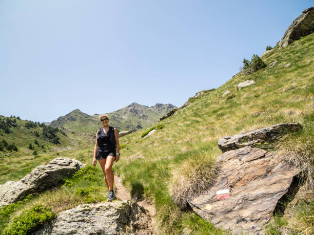 istock Smiling woman in the Pyrenees mountains 2164459359