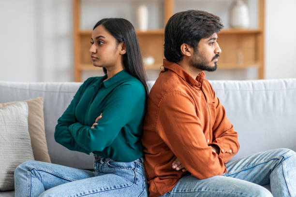istock Young Couple Having Serious Argument on Couch at Home 2164487258