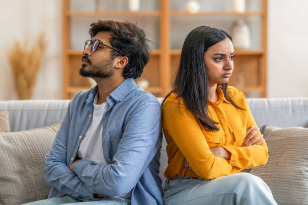 istock Upset Couple Sitting Back To Back On Sofa 2164487282
