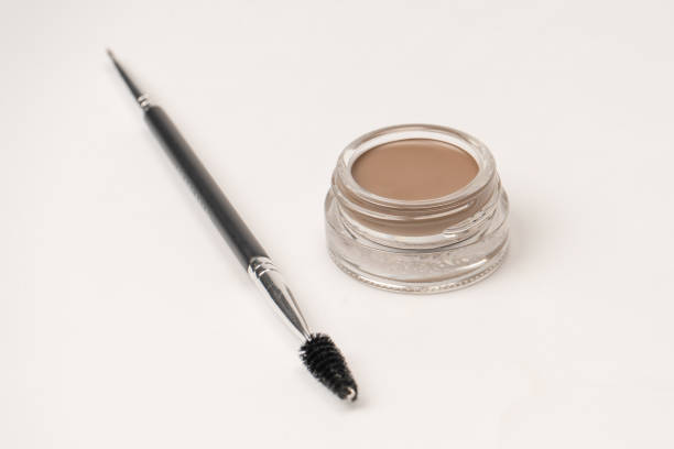 istock A brow pomade in blonde shade with brush isolated on a white background. 2164488516