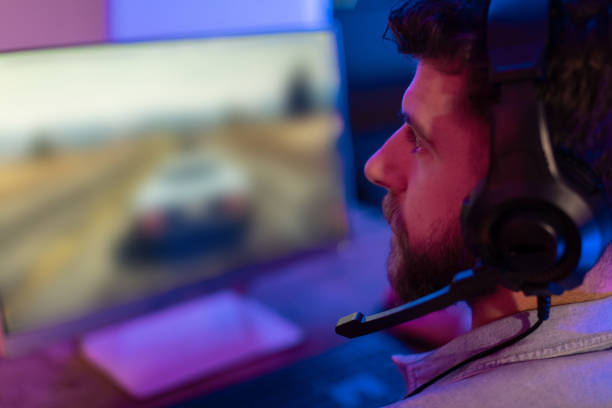 istock Gamer engaged in an intense gaming session 2164489356