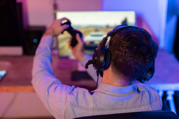 istock Gamer celebrating with hands in the air 2164489370