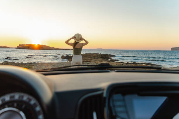 istock Enjoying sunset by the sea 2164491128