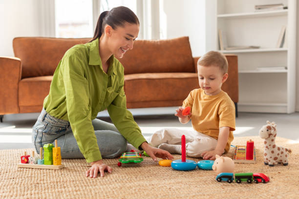istock Woman Playing With Child on the Floor 2164491396