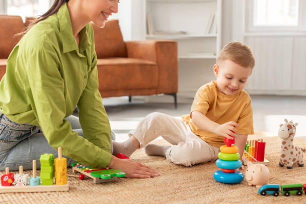 istock Mother Playing With Child on Floor at Home 2164491467