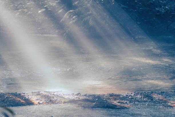 A ray of light shining on a mountain stream.