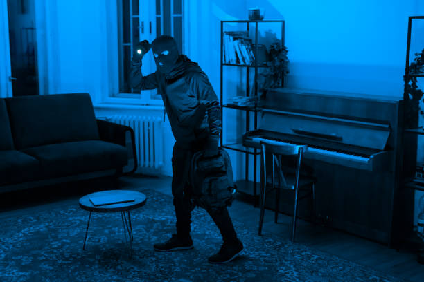 istock Lone figure in a room with a piano at night 2164493482