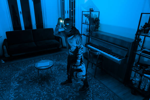 istock Silhouetted individual with light in a room 2164493484