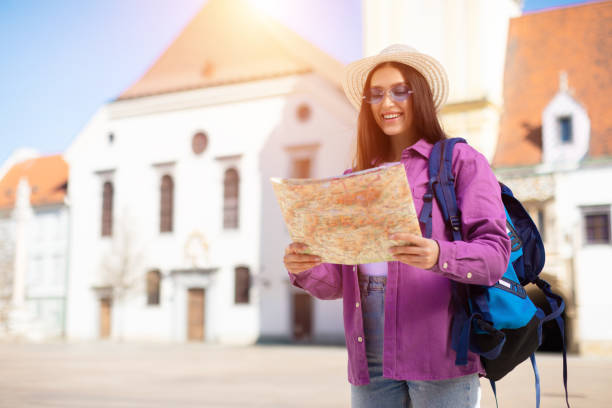 istock Traveling student reading a map in sun 2164495956