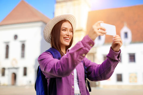 istock Tourist taking a selfie in a city 2164495966