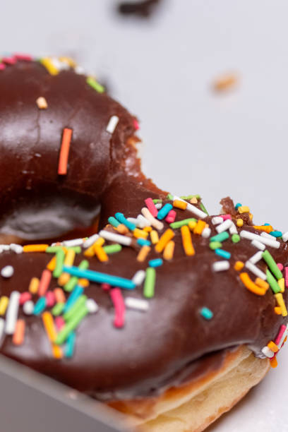 istock chocolate and cream donut in close-up 2164496872