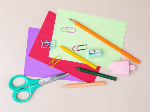 istock Back to school backdrop. School supply over light brown background 2164501327