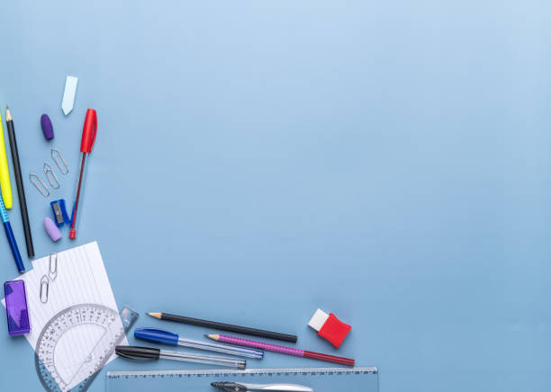 istock Back to school backdrop. School supply over light blue background with copy space 2164501375