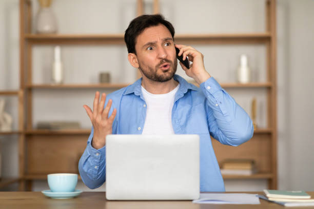 istock Frustrated Man Having a Conversation on His Phone 2164502194