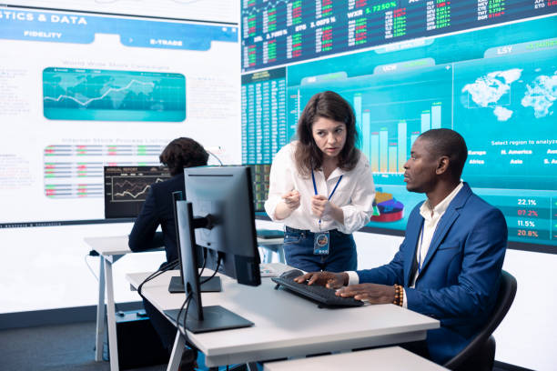 istock Diverse teammates examining statistics and infographics on computer 2164508052