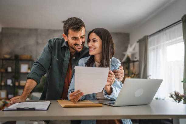 istock couple boyfriend and girlfriend read together letter from envelope 2164510070