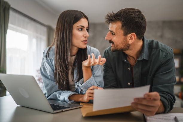 istock couple boyfriend and girlfriend open together letter from envelope 2164510251