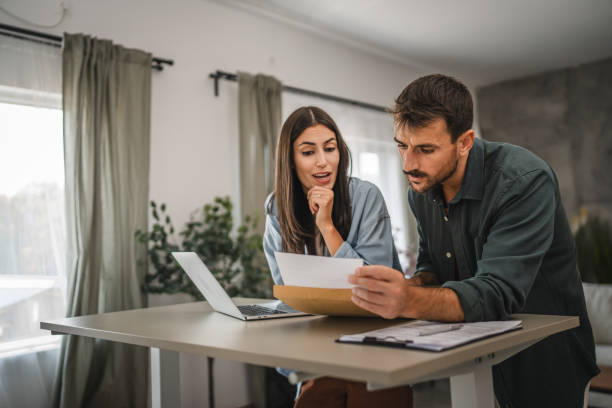 istock couple boyfriend and girlfriend open together letter from envelope 2164510549