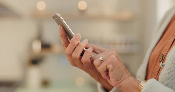 istock Home, hand and elderly woman with phone for internet, communication and learning on technology. House, network and senior person with smartphone for online media, information and digital news website 2164514784