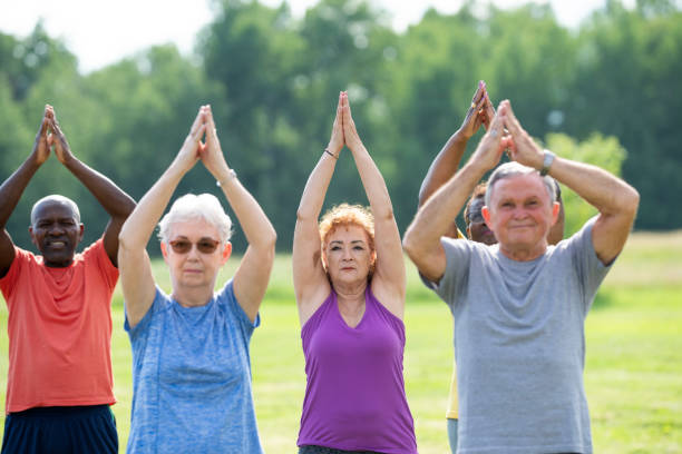istock Seniors Outdoor Yoga Class 2164524374