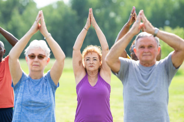 istock Seniors Outdoor Yoga Class 2164524375