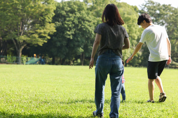 istock Family in morning park 2164532701