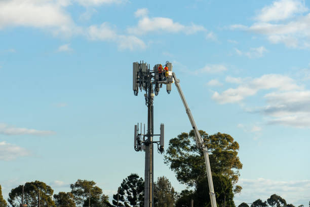 istock Works on the transmitter tower with telecommunication equipment 2164538496