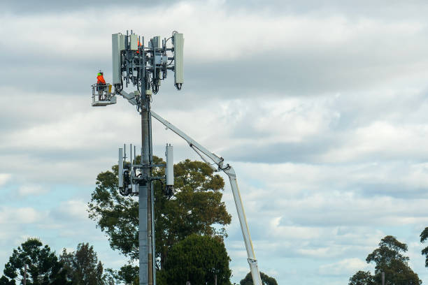 istock Works on the transmitter tower with telecommunication equipment 2164538499