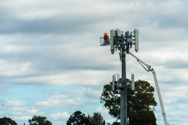istock Works on the transmitter tower with telecommunication equipment 2164538504