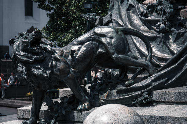 Three children supporting a cup with flowers and fruits, symbol of abundance, is a monument in Praça da Liberdade in Porto (work by Henrique Moreira, 1931)