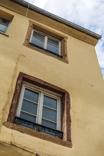 istock Colorful Building Facade with Windows and Balconies 2164545026