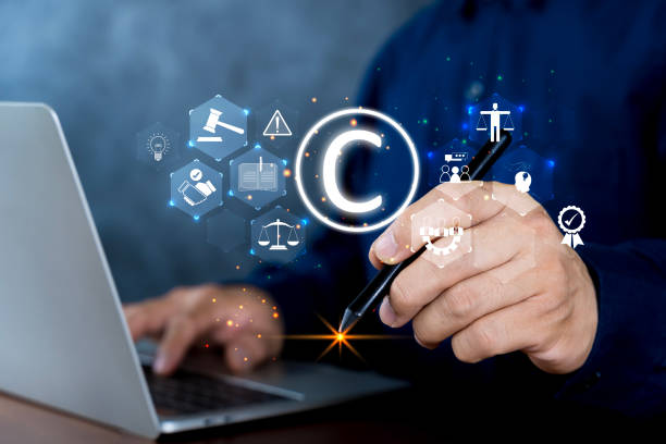 istock Businessman use laptop with virtual copyright symbol for author rights and patented intellectual property. 2164549748