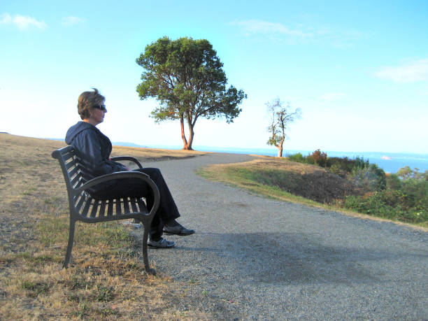 istock Woman on Bench Overlooking Puget Sound 2164550108