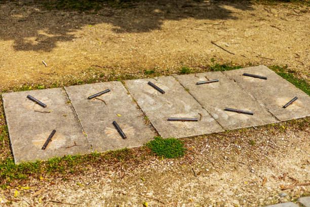 istock Utility Cover with Metal Rods on Stone Slabs 2164551290
