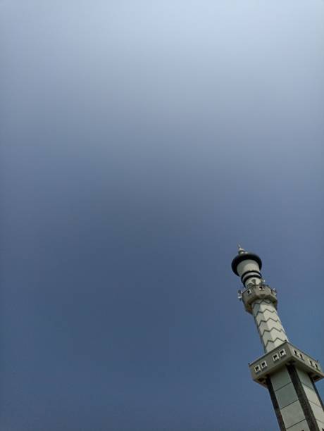 istock Mosque pillar architecture with blue sky, the negative space of the mosque pillars can be used as a background. Low angle of the Mosque Tower 2164561663
