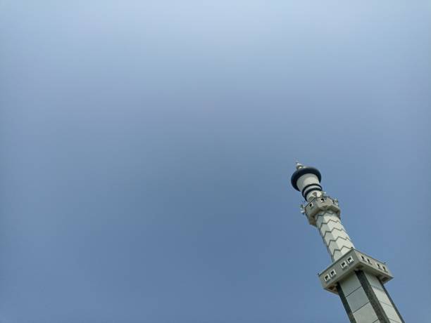 istock Mosque pillar architecture with blue sky, the negative space of the mosque pillars can be used as a background. Low angle of the Mosque Tower 2164561676