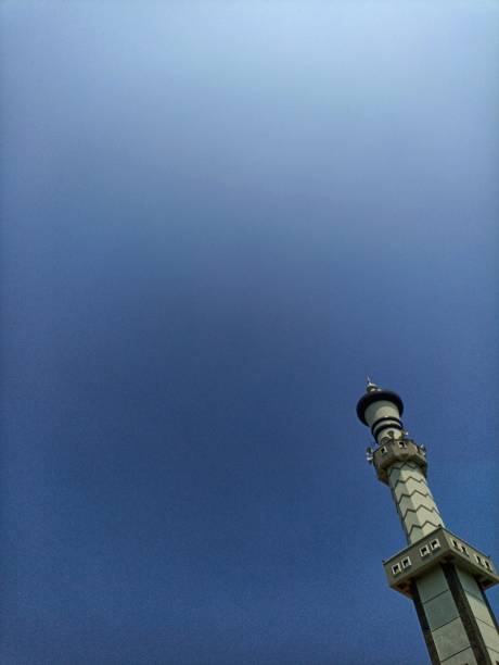 istock Mosque pillar architecture with blue sky, the negative space of the mosque pillars can be used as a background. Low angle of the Mosque Tower 2164561686