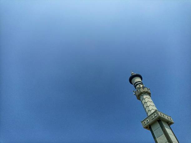 istock Mosque pillar architecture with blue sky, the negative space of the mosque pillars can be used as a background. Low angle of the Mosque Tower 2164561697