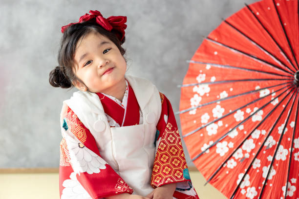 istock girl wearing kimono 2164562594