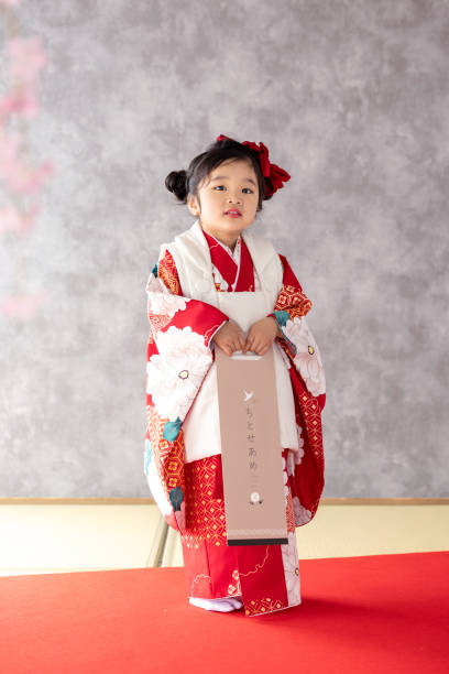 istock girl wearing kimono 2164562597