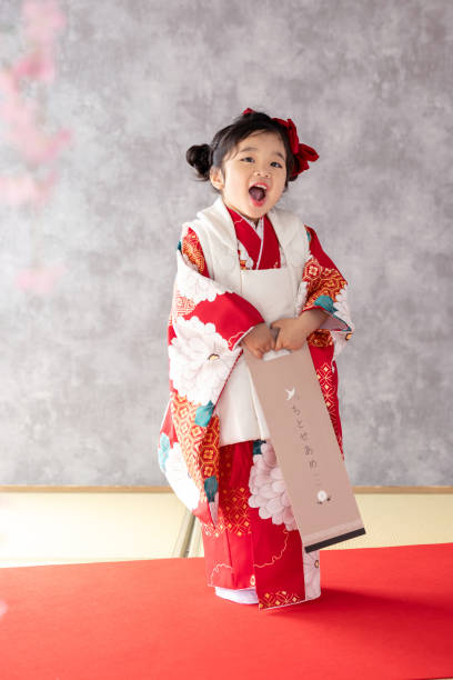 istock girl wearing kimono 2164562599