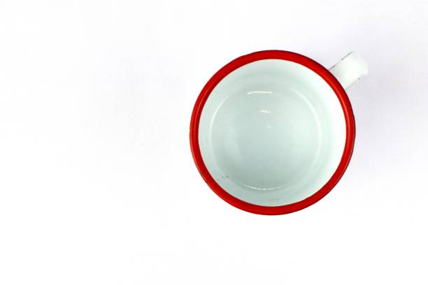 istock White enamel glass with floral pattern on isolated white background 2164569757