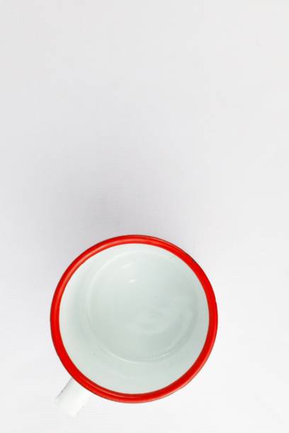 istock White enamel glass with floral pattern on isolated white background 2164569758
