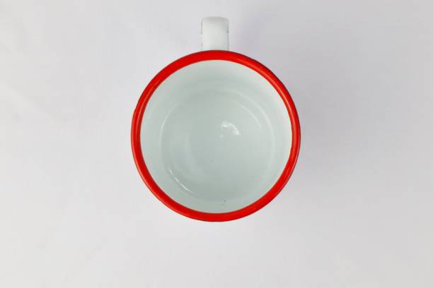 istock White enamel glass with floral pattern on isolated white background 2164569761