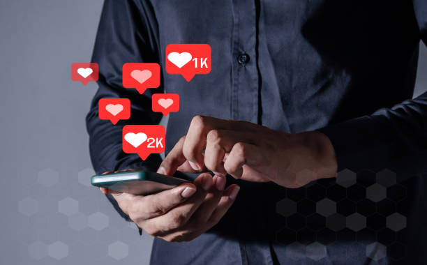 istock Young Man using smart phone mobile with Social Media icon, Like Follow and Comment 2164570796